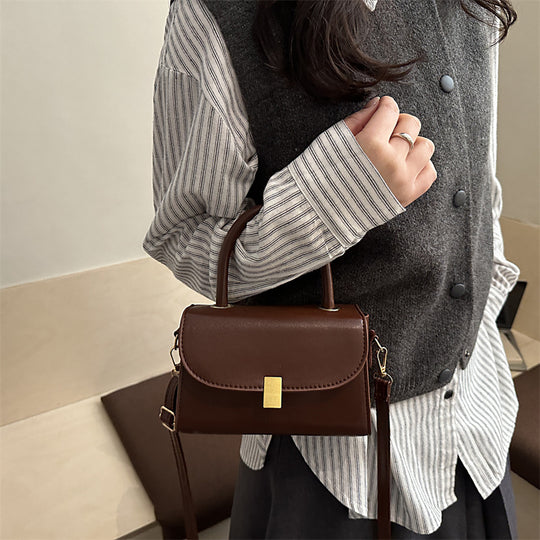 Damen-Handtasche mit abnehmbarem Schulterriemen und eleganter Verschlussmechanik Nord Taschen