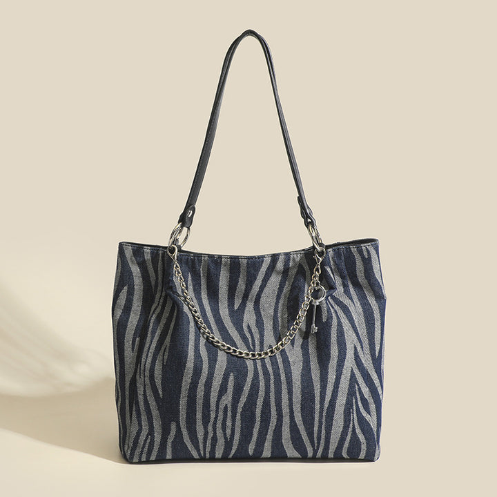 Damen Tragetasche mit schickem Zebramuster und eleganten Kettenakzenten Nord Taschen