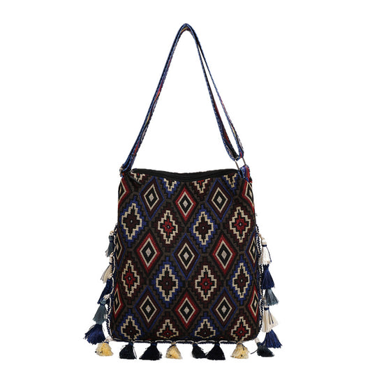 Damen Umhängetasche mit buntem geometrischen Muster und charmanten Quasten Nord Taschen