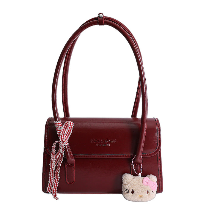 Damen elegante Handtasche mit verspieltem Stoffanhänger Nord Taschen