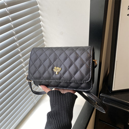 Damen Umhängetasche mit eleganter Steppung und goldenen Akzenten Nord Taschen