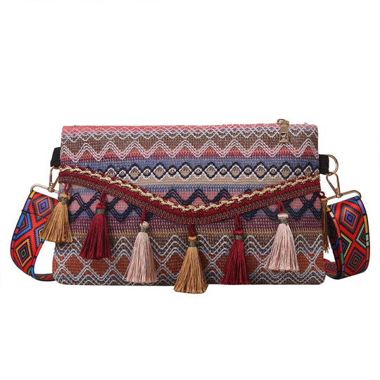 Damen modische Clutch-Tasche mit fransigen Akzenten und buntem Stickmuster Nord Taschen
