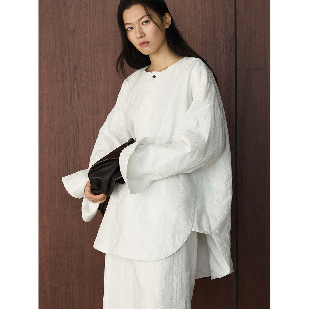 Damen Oversized strukturierte Longbluse mit Rundhals und verlängertem Saum Nord Taschen