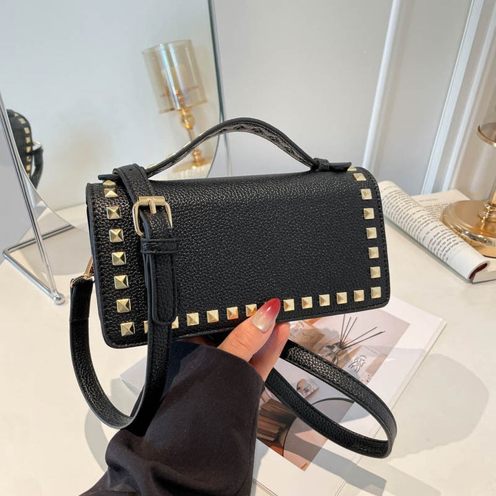 Damen Mini-Handtasche mit glitzerndem Obermaterial und goldenen Nieten Nord Taschen