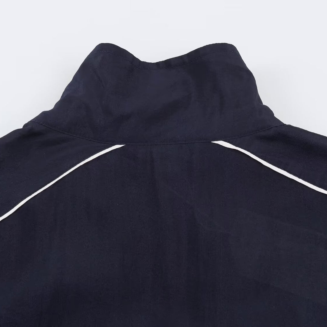 Damen Cropped Windbreaker-Jacke mit hohem Funnelkragen, Kontrastpaspel und elastischem Saum Nord Taschen