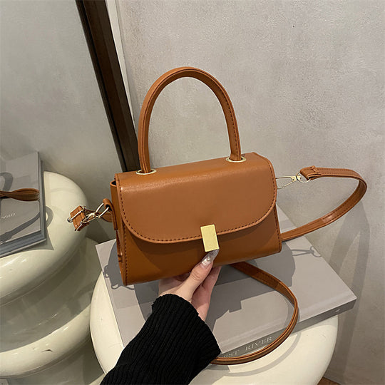 Damen-Handtasche mit abnehmbarem Schulterriemen und eleganter Verschlussmechanik Nord Taschen