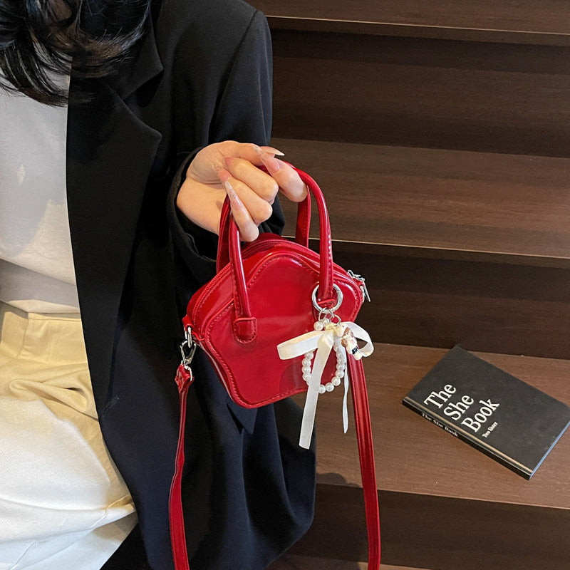 Damen modische Handtasche mit verspieltem Anhänger Nord Taschen