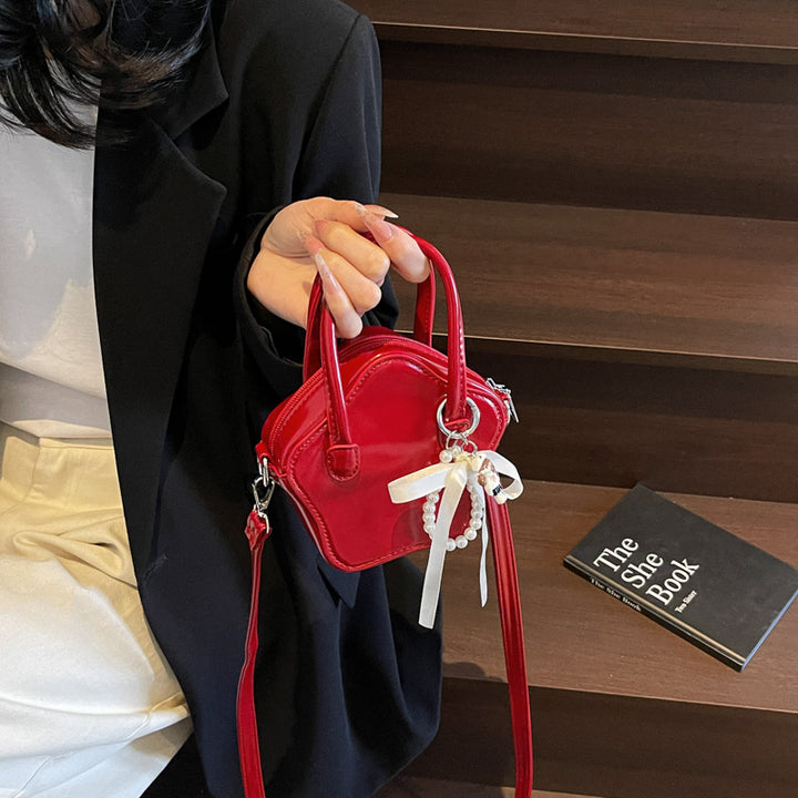 Damen modische Handtasche mit verspieltem Anhänger Nord Taschen