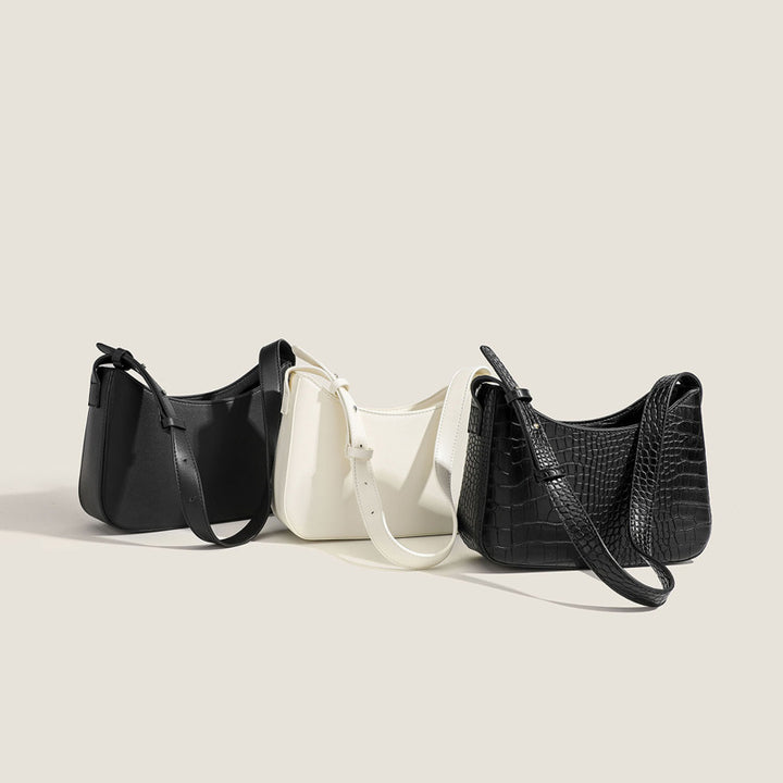 Damen Schultertasche mit geschwungener Silhouette und stylischem Gurt Nord Taschen
