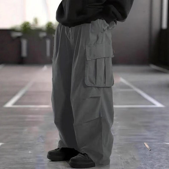 Herren Oversize-Baggy-Cargohose im Urban-Utility-Stil mit elastischem Tunnelzugbund und Mehrfachklappentaschen Nord Taschen