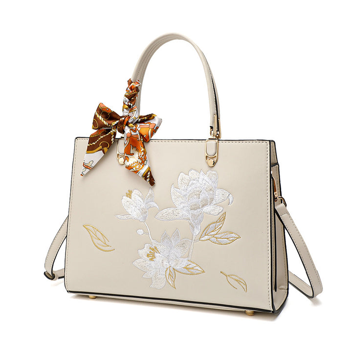 Damen stilvolle Handtasche mit floralem Stickdesign und elegantem Schal Nord Taschen