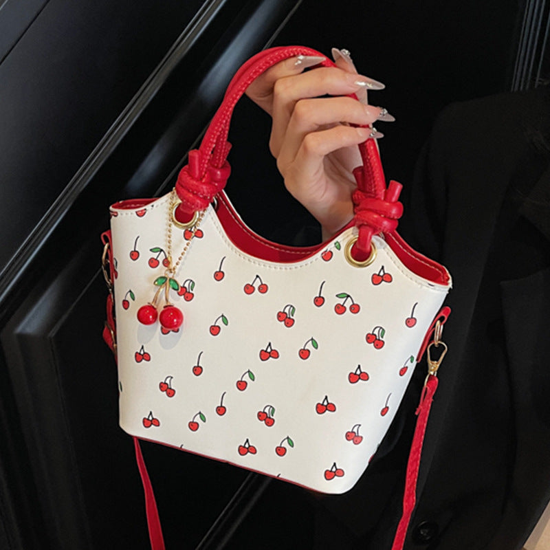 Damen Handtasche mit charmantem Kirschdesign und eleganten Details Nord Taschen