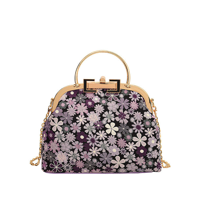 Damen elegante Umhängetasche mit floralen Akzenten und goldenen Verzierungen Nord Taschen