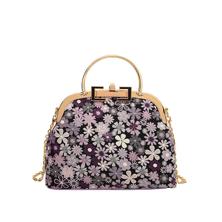 Damen elegante Umhängetasche mit floralen Akzenten und goldenen Verzierungen Nord Taschen