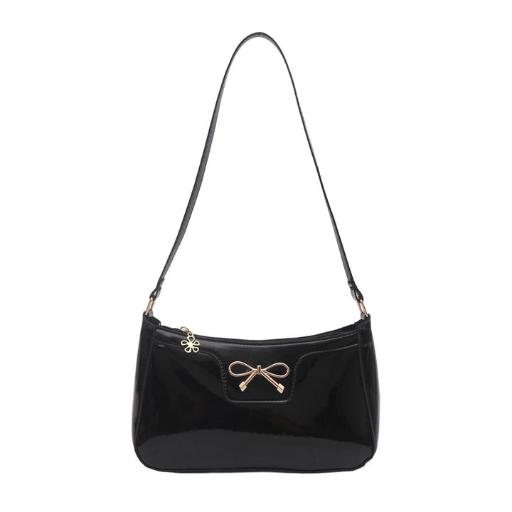 Damen elegante Umhängetasche mit schimmerndem Lackfinish und dekorativem Schleifenakzent Nord Taschen