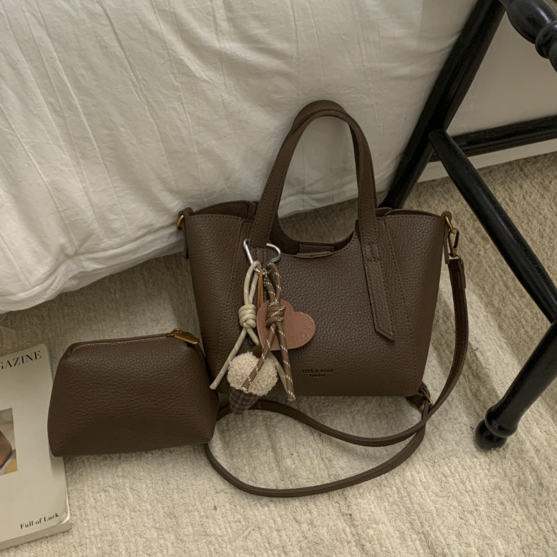 Damen Mini-Handtasche im eleganten Design mit charmantem Anhänger Nord Taschen