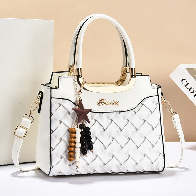 Damen elegante Handtasche mit kunstvollem Flechtmuster und abnehmbarer Quaste Nord Taschen