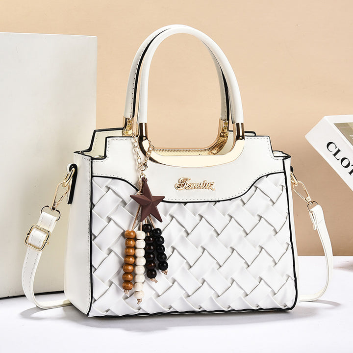 Damen elegante Handtasche mit kunstvollem Flechtmuster und abnehmbarer Quaste Nord Taschen