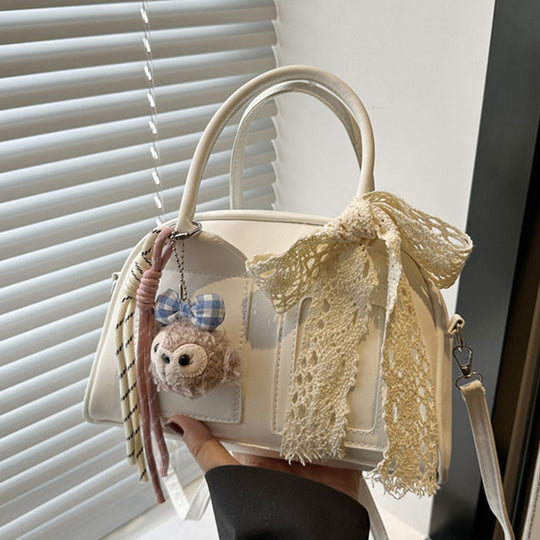 Damen Mini-Handtasche mit niedlichem Plüschanhänger und filigraner Schleifenverzierung Nord Taschen