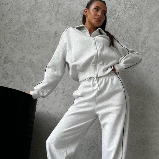 Damen lässiges Sweatset mit Stehkragen Reißverschluss gekürzter Jacke und hochtaillierter Schlaghose Nord Taschen