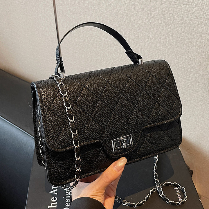 Damen Handtasche mit eleganter Steppung und schickem Metallverschluss Nord Taschen