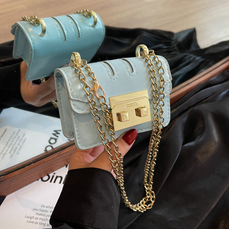 Damen elegante Mini-Handtasche mit goldener Verschlussmechanik Nord Taschen