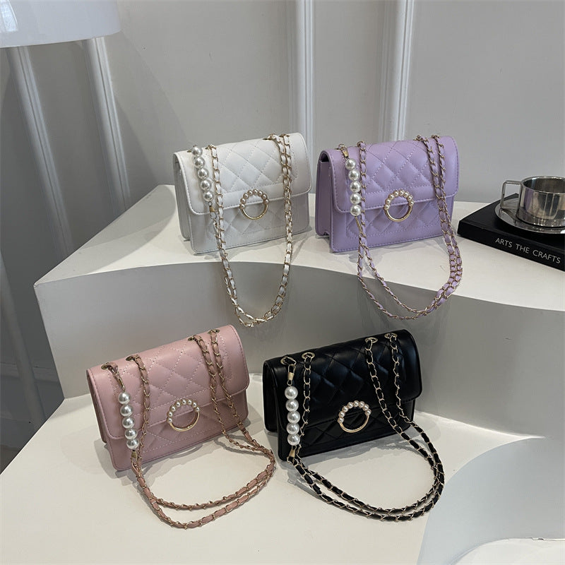 Damen elegante Handtasche mit strukturiertem Design und femininen Perlenakzenten Nord Taschen