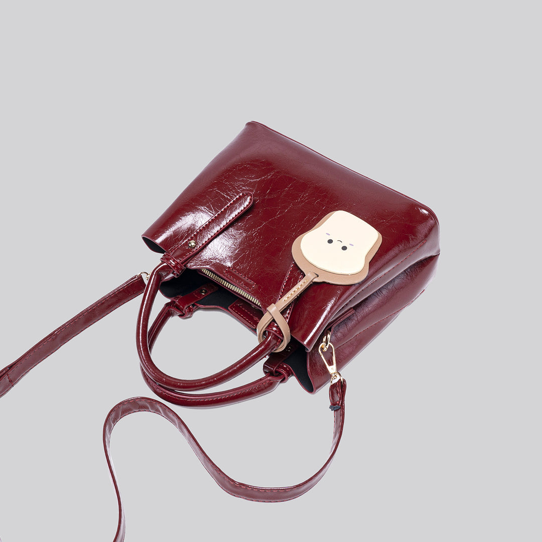 Damen modische Handtasche mit verspieltem Anhänger Nord Taschen