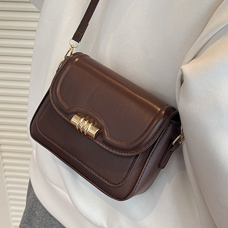 Damen elegante Umhängetasche mit strukturiertem Design und goldfarbenem Verschluss Nord Taschen