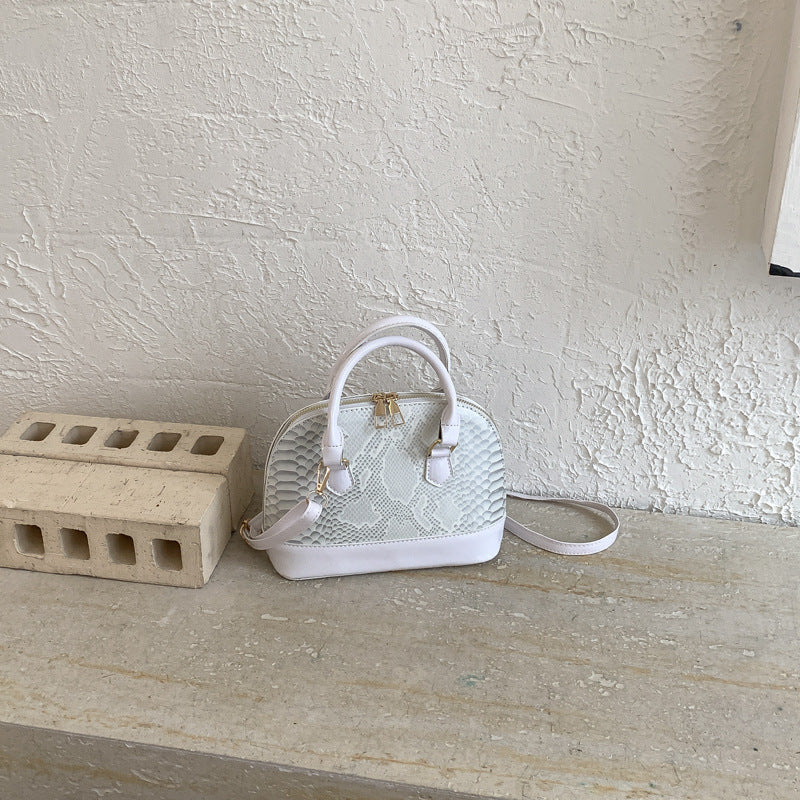 Damen elegante Handtasche im stilvollen Schlangenleder-Look Nord Taschen