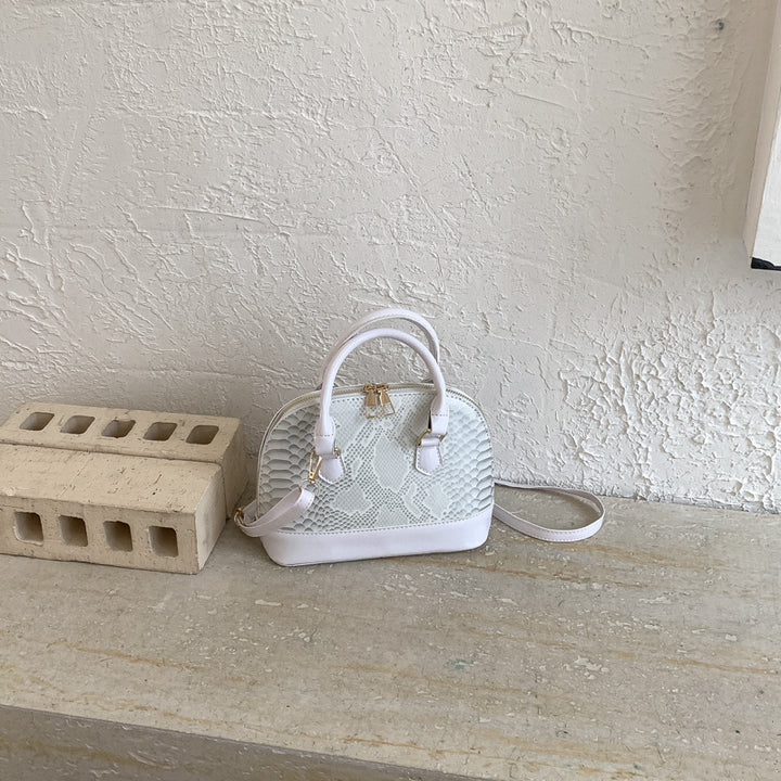 Damen elegante Handtasche im stilvollen Schlangenleder-Look Nord Taschen