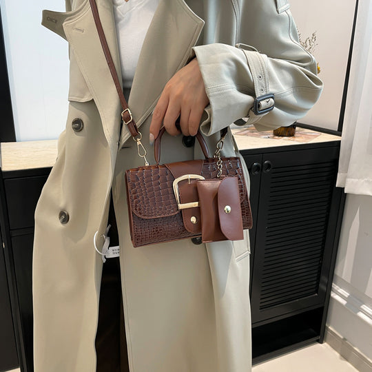 Damen Umhängetasche aus strukturiertem Krokodilleder mit eleganter Schnallenverzierung Nord Taschen