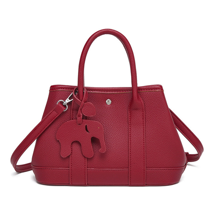 Damen Handtasche mit abnehmbarem Elefantenanhänger und elegantem Kunstleder Nord Taschen