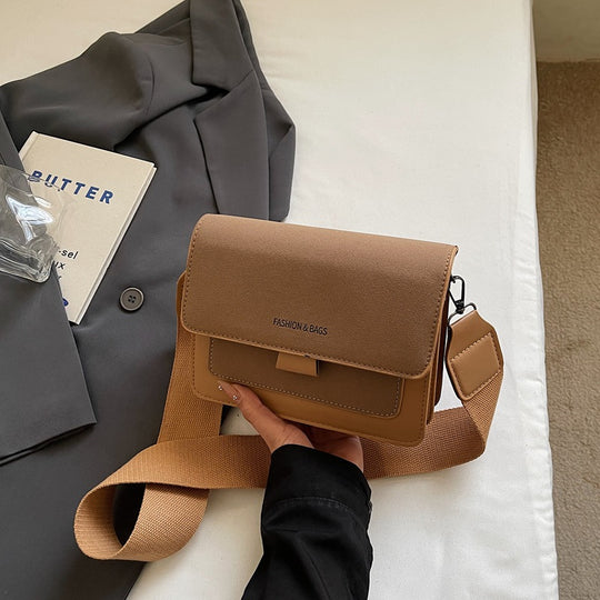 Damen Umhängetasche mit innovativem Klappverschluss und hochwertigen Akzenten Nord Taschen