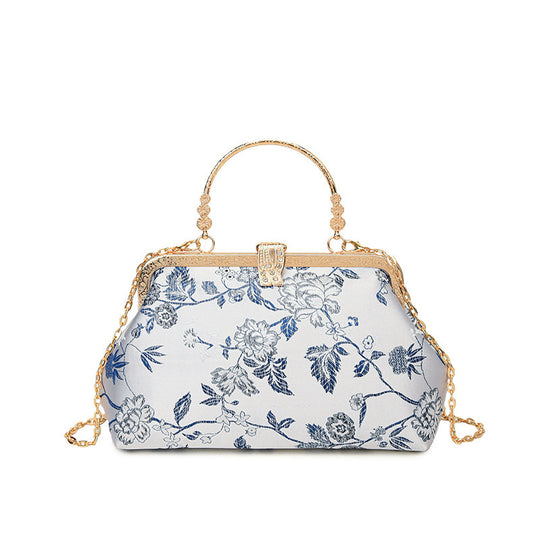 Damen stilvolle Handtasche mit floralem Design und goldfarbenen Akzenten Nord Taschen
