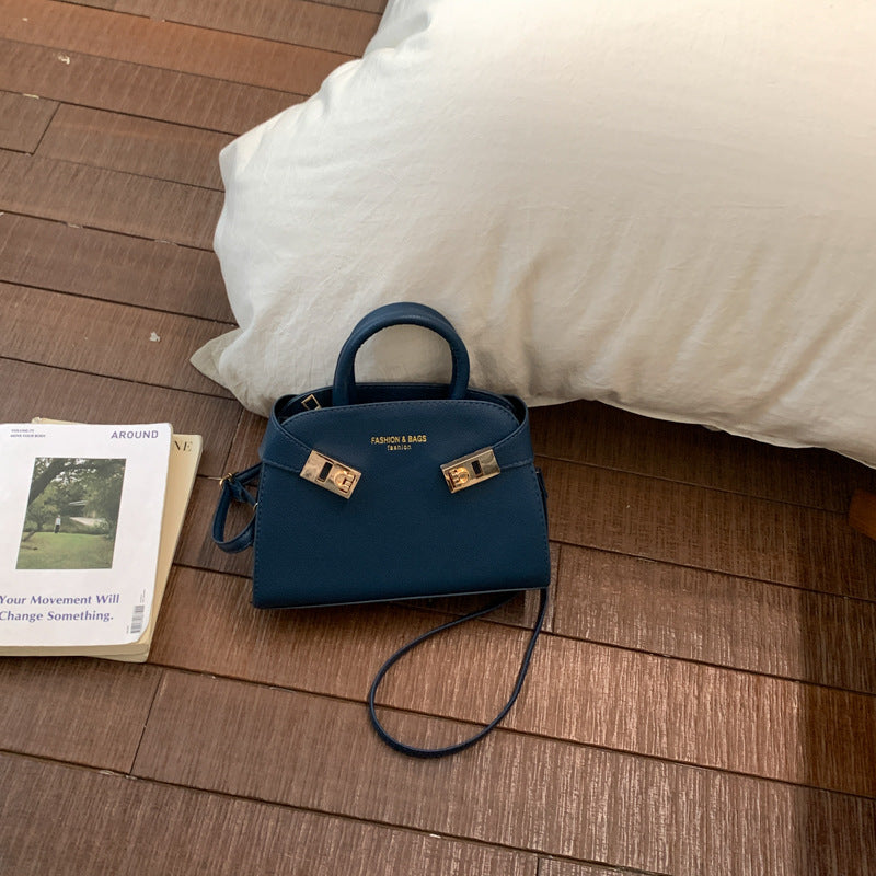 Damen elegante Handtasche mit verspieltem Verschluss Nord Taschen