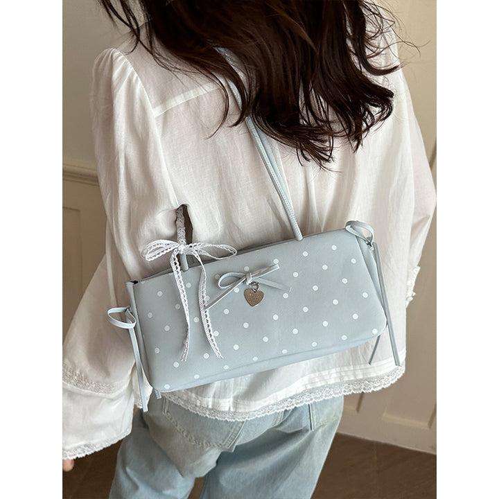 Damen Handtasche mit spielerischem Punktemuster und eleganten Details Nord Taschen