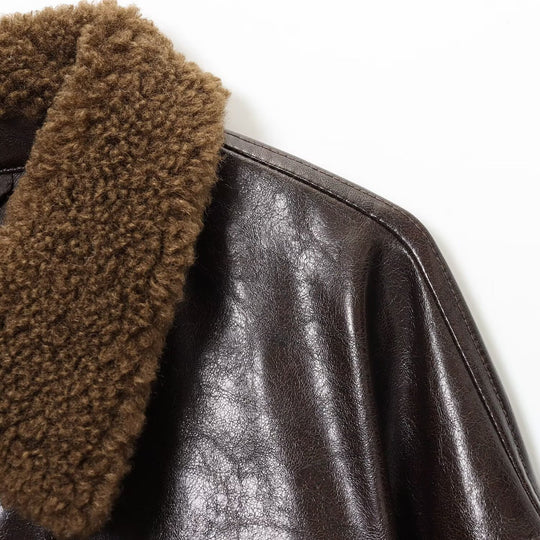 Damen Oversized Lederimitat-Jacke mit Teddykragen und Taillengürtel Nord Taschen