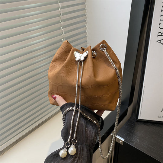 Damen Handtasche mit elegantem Kordelzug und detaillierter Schlangenprägung Nord Taschen