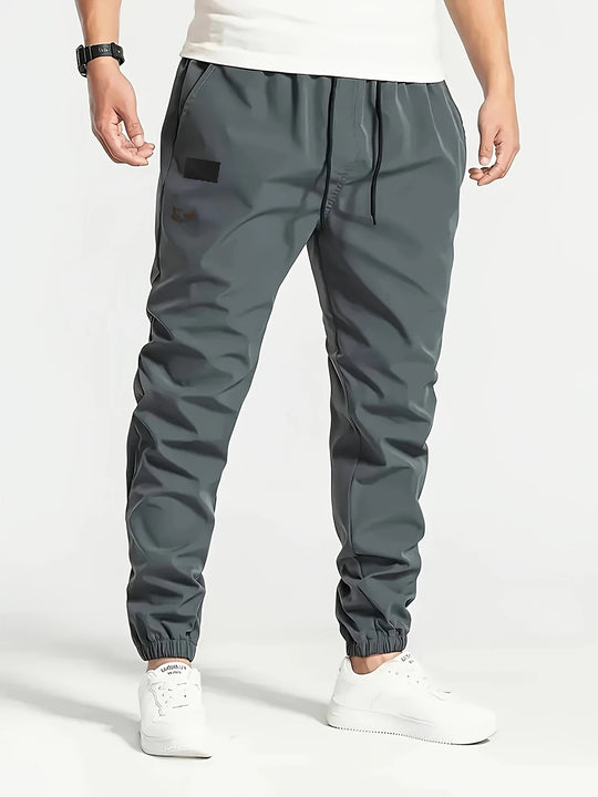 Herren Technische Jogginghose im Tapered‑Utility‑Stil mit elastischem Bund & Knöchelbündchen Nord Taschen
