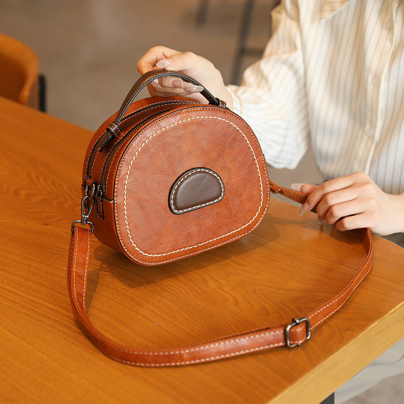 Damen Designer Umhängetasche mit innovativem runden Schnitt Nord Taschen