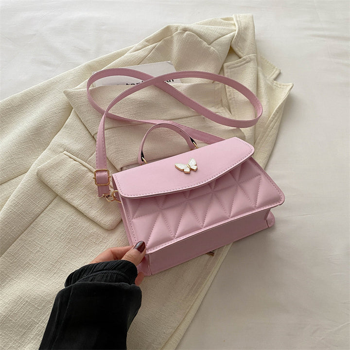 Damen elegante Handtasche mit Quermuster und stylischem Schmetterling Nord Taschen