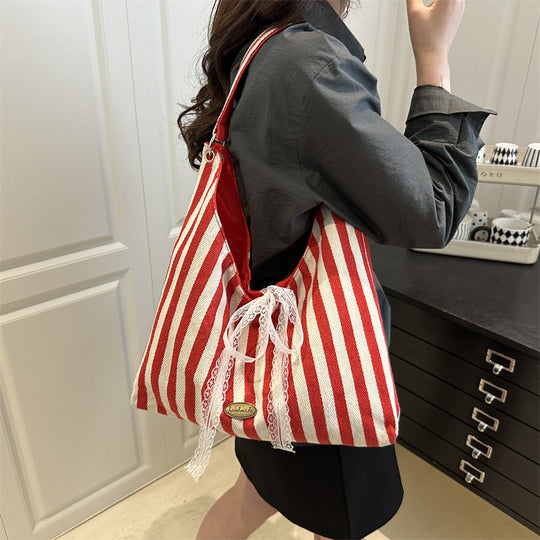 Damen Hobo-Tasche mit modernem Streifenmuster und verspieltem Kordelzug Nord Taschen