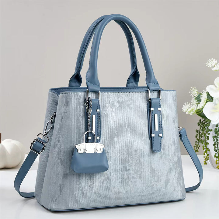 Damen elegante Handtasche mit dekorativem Schlüsselanhänger Nord Taschen
