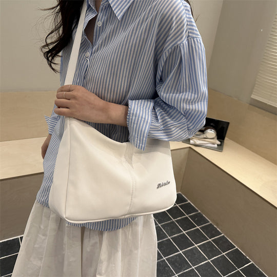 Damen Umhängetasche mit eleganter Struktur und Filterverschluss Nord Taschen
