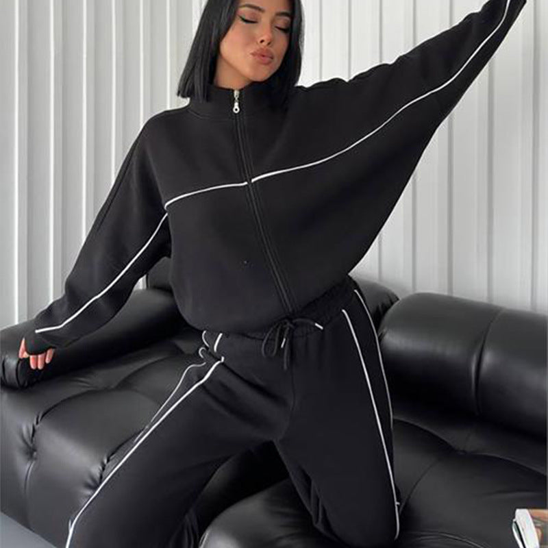 Damen lässiges Sweatset mit Stehkragen Reißverschluss gekürzter Jacke und hochtaillierter Schlaghose Nord Taschen