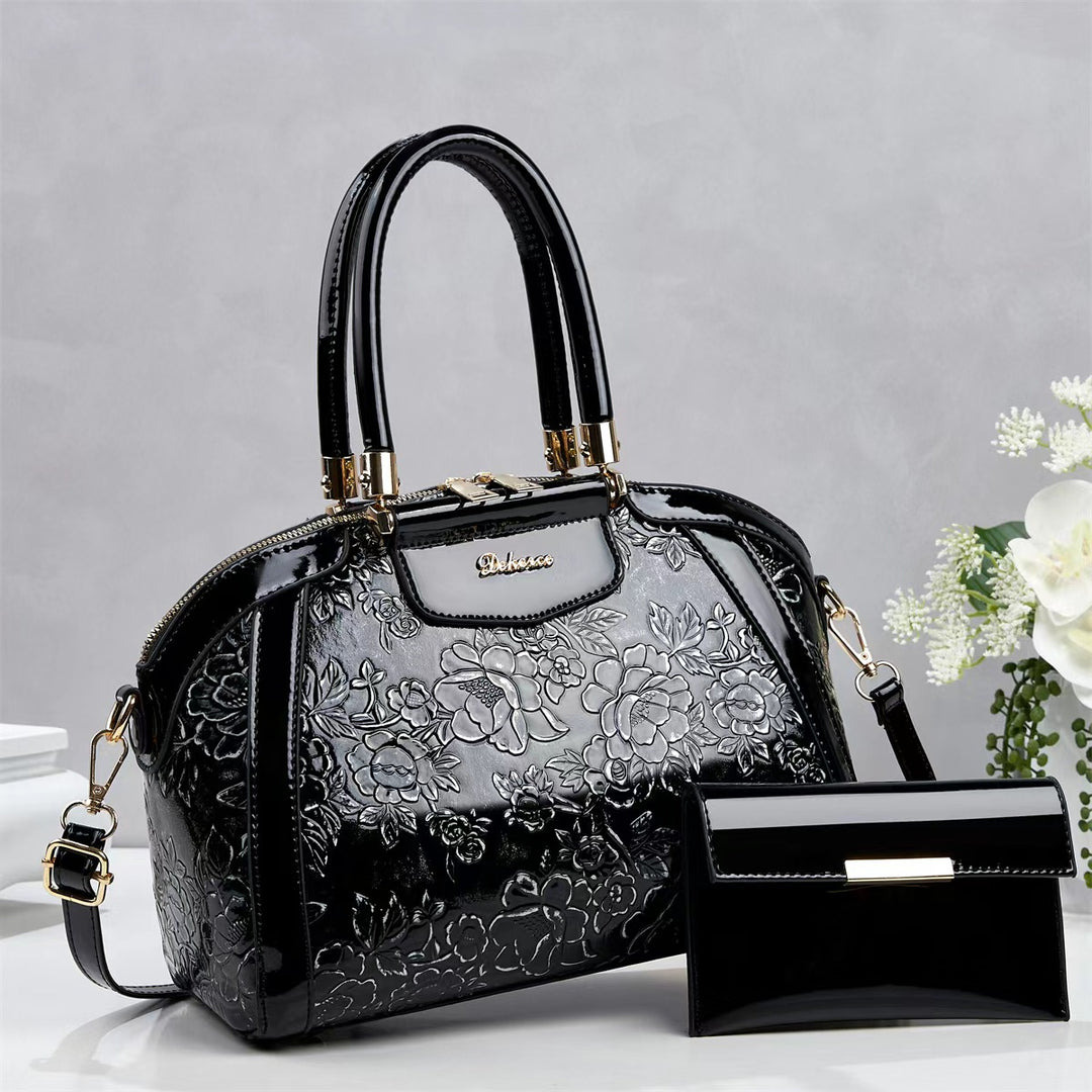 Damen modische Handtasche mit floralen Prägungen und Glanz-Akzenten Nord Taschen
