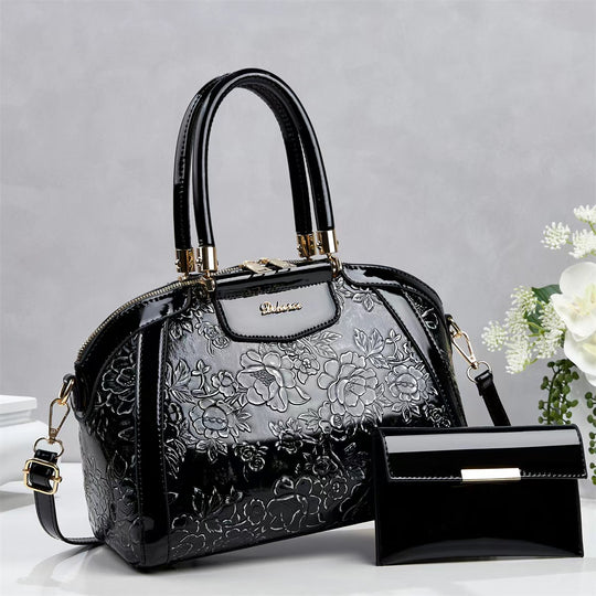Damen modische Handtasche mit floralen Prägungen und Glanz-Akzenten Nord Taschen