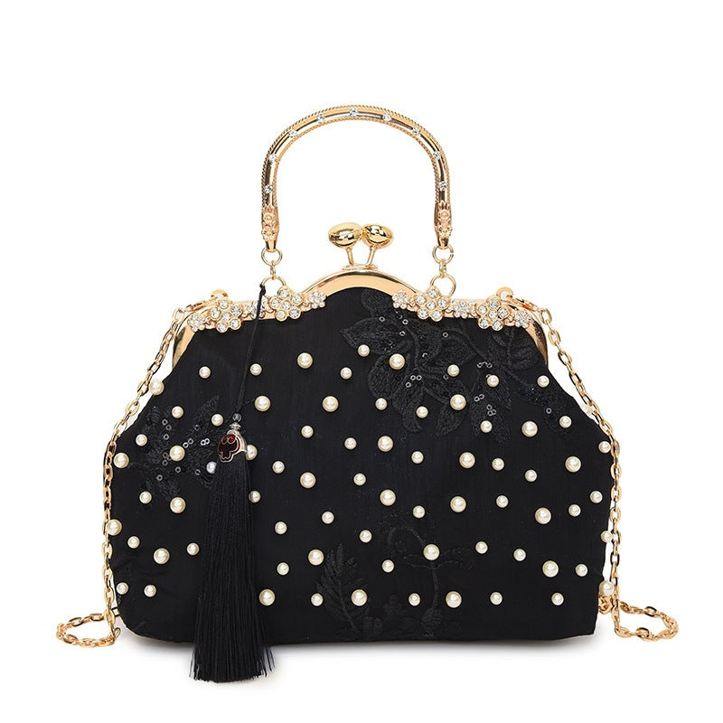 Damen elegante Handtasche mit perlenverziertem Design und Metallakzenten Nord Taschen