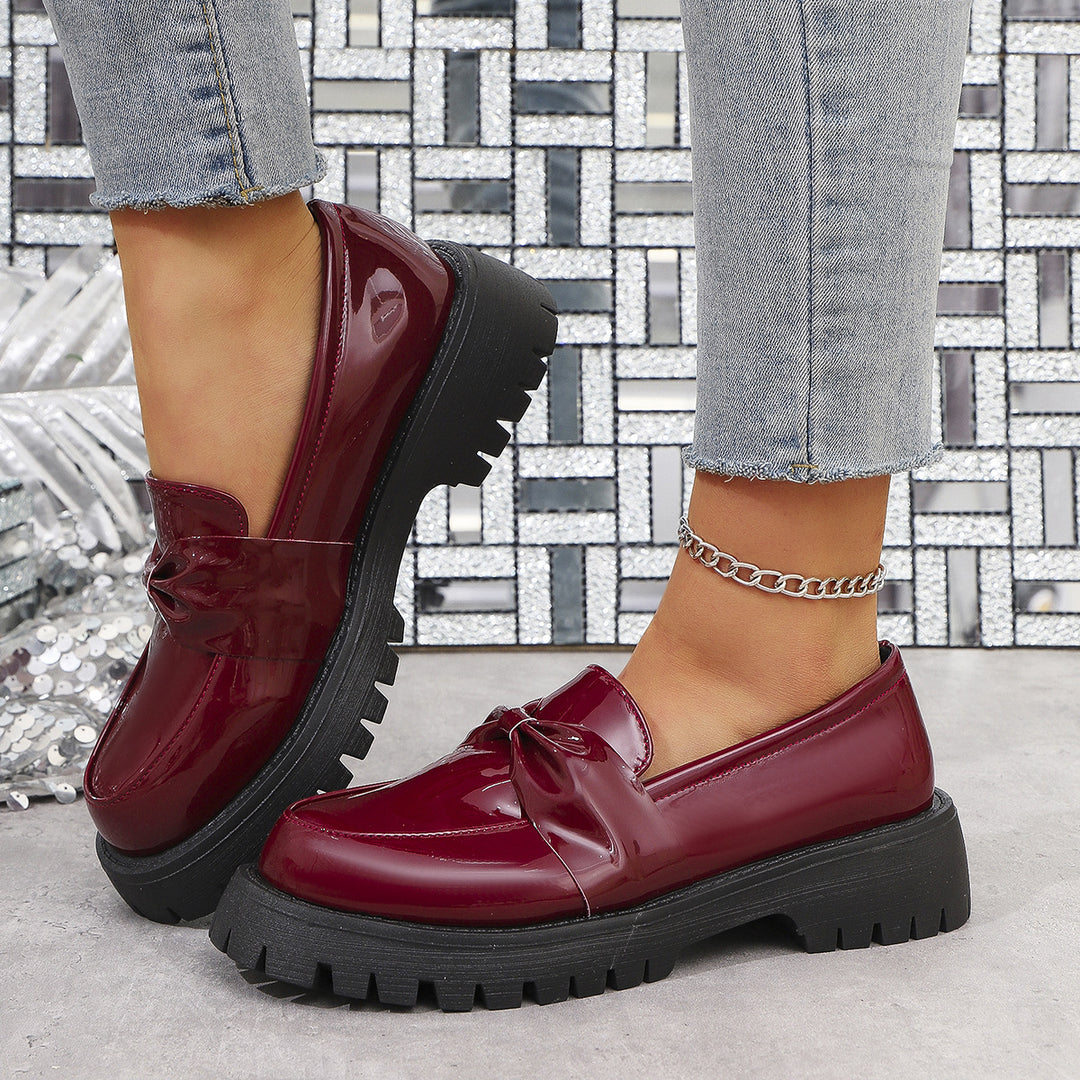 Damen  glänzende Plateau-Loafer mit übergroßer Schleifenapplikation und profilierter Gummisohle Nord Taschen